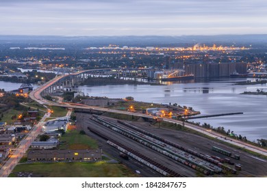 A Telephoto Long Exposure Shot of the Blatnik Bridge spanning the St. Louis River connecting Superior WI, and Duluth, MN during a Morning Twilight