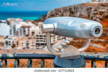 Telescope With A City View From A High Vantage Point.