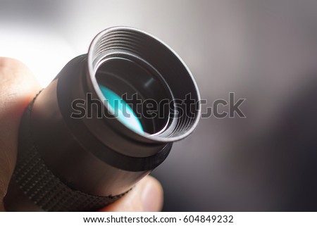 Telescope eyepiece with rubber eyecup, hand hold