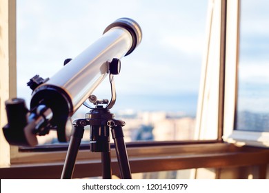 the telescope on the balcony, Telescope on the tripod, shallow depth of field