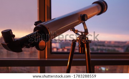 telescope on the balcony, Telescope on the tripod, shallow. Telescope for sky observation, Hobbies and training for children