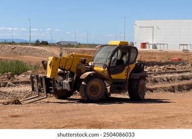 Telescopic handler work on construction site. Forklift Construction machinery for loading. Wheel loader for lifting goods. 