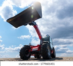 Telescopic Loader Against The Blue Sky