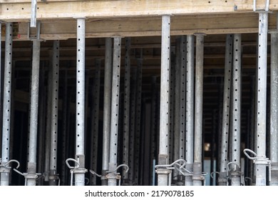 telescopic steel support bars acrow props supporting the ceiling on the construction site