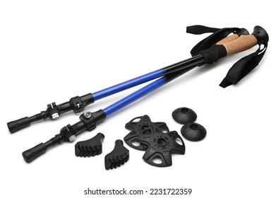 Telescopic trekking poles with baskets and tips accessories on white background
