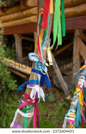 Teletskoye Lake, Altai Republic.The tradition of tying ribbons to trees for good luck and wish fulfillment.
