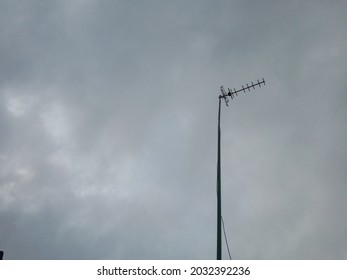 Television Antenna (signal Catcher) On A Dark Sky Background In The Morning