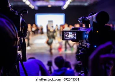 Television Camera Broadcasting a Show, Fashion Show, Catwalk event, Fashion Week themed photo.