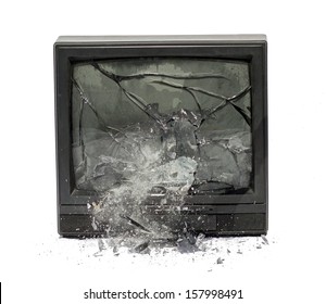 Television Exploding Isolated On White Background. Broken Screen Monitor. Damaged The Older TV With Falling Shards Of Glass From The Screen. 