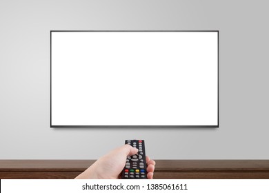 Television On White Wall With Hand Using Remote Control, TV 4K Flat Screen Lcd Or Oled, Plasma Realistic Illustration, White Blank HD Monitor Mockup, Modern Video Panel White Flatscreen.