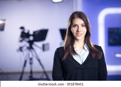 Television Presenter Recording In News Studio.Female Journalist Anchor Presenting Business Report,recording In Television Studio.News Camera,light Equipment Behind The Scenes. TV Program Editor.