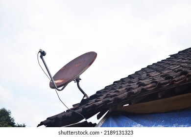television satellite dish installed on the roof of the house