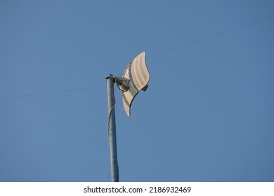 A Television Signal Catcher Or Television Antenna With A Blue Sky Background