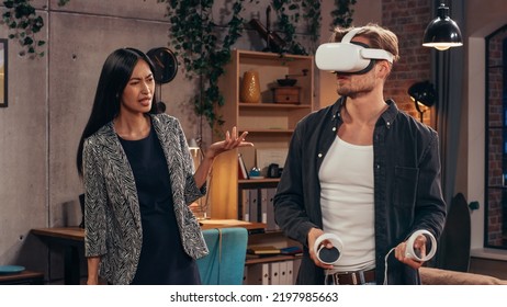 Television Sitcom Living Room: Couple Has Relationship Problems. Funny Sketch About Guy Having VR Metaverse Addiction, Girl Confronts Him. Comedy Series Broadcast Network Channel, Streaming Service.