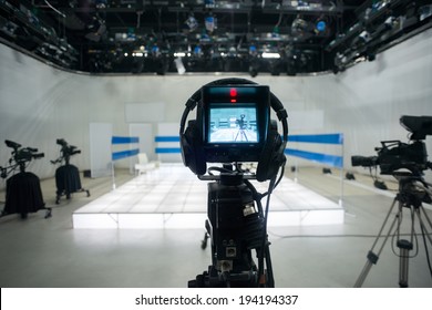 Television Studio With Jib Camera And Lights - Camera On A Crane. Shallow Depth Of Field - Focus On Camera 