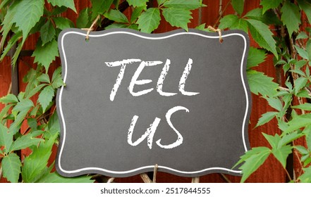 Tell us symbol. Concept words Tell us on black chalk blackboard. Beautiful red background with plants. Business and Tell us concept. Copy space. - Powered by Shutterstock