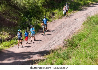 Telluride, USA - August 14, 2019: Small Town In Colorado With Group Of People Family Hiking Walking Down Hill From Mountain Village In Summer