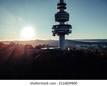 The Telstra Tower surrounded by trees under the sunlight in Canberra, Australia