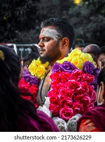 Teluk intan, Perak, Malaysia - April 16 2022 : A Hindu devotee seen with a sharp self piercing on their body as a ceremonial act during the Thaipusam festival.