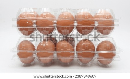 Telur ayam or Fresh chicken eggs served on a white shelf,selective focus