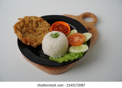 Telur dadar, telur gimbal or called penyetan telur Sambal is a Indonesian fried egg with Tofu and Tempeh any fresh vegetable and smashed with spicy sambal. Daily asian 