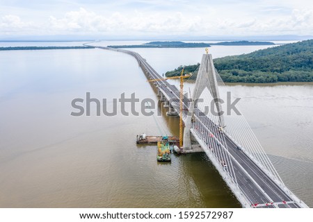 Temburong Bridge is a 30-kilometre (19-mile) bridge currently under construction in Brunei. It will connect Mengkubau and Sungai Besar in Brunei-Muara District and Labu Estate in Temburong District.