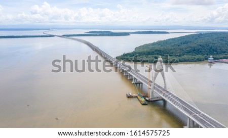 Temburong Bridge is a 30-kilometre (19-mile) bridge currently under construction in Brunei. It will connect Mengkubau and Sungai Besar in Brunei-Muara District and Labu Estate in Temburong District.