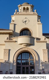 Temecula, California, USA - 16 May 2022: The Front Of City Hall Under A Clear Blue Sky. Late Afternoon Shadow Shades The Wooden Door Beneath A Clock Tower: Mission Revival Architecture With Copy Space