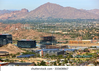 Tempe, Arizona USA-October 27, 2015:  Aerial view from above the campus of Arizona State University showing growth along the Tempe Town Lake continuing with the addition of State Farm's buildings.