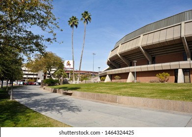 TEMPE, AZ / USA - FEBRUARY 6 2011:  The Sidewalk Outside Of ASU Wells Fargo Arena At 600 E Veterans Way On Right And Sun Devil Football Stadium In Background On Left.