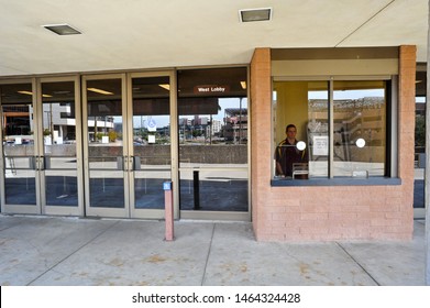 TEMPE, AZ / USA - FEBRUARY 6 2011:  A Ticket Seller Sits Inside The Ticket Window Of ASU Wells Fargo Arena At 600 E Veterans Way In Tempe, Arizona.