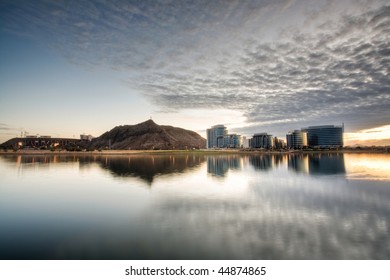 Tempe Town Lake with downtown tempe, A mountain, and a stadium visible.