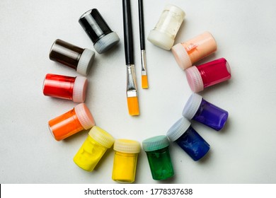 temperas of various colors and brushes, to paint and create art - Shutterstock ID 1778337638