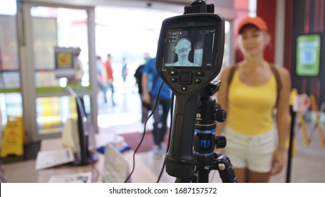 Temperature Check At A Supermarket, Grocery Store With Thermal Imaging Camera Installed. Image Monitoring Scanner To Monitor The Body Temp Of Visitor Customer. Coronavirus Pandemic Outbreak. Covid-19.