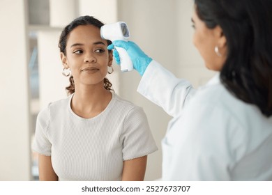 Temperature, consultation and woman with doctor at clinic for flu, cold or allergies symptoms. Healthcare, checkup and medical worker with laser thermometer for female patient with fever in hospital. - Powered by Shutterstock