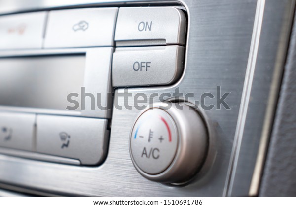 Temperature control knob in\
car air conditioning system close up, comfort and fresh air in\
vehicle cabin.