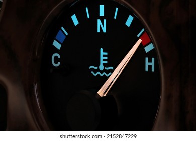 temperature gauge in car dashboard in illuminated night mode - hot - Shutterstock ID 2152847229