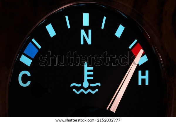 temperature gauge in car dashboard in illuminated\
night mode - hot