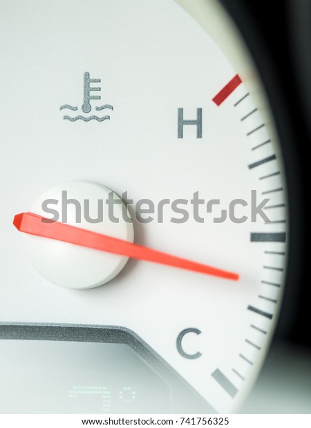 Temperature\
gauge. Medium position. White\
dashboard.