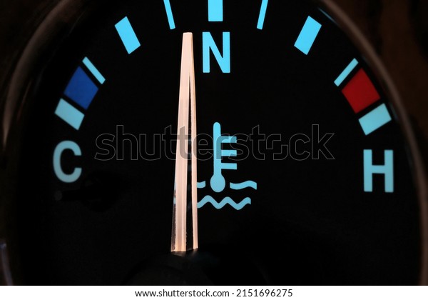 temperature gauge at normal\
operating temperature in car dashboard in illuminated night\
mode