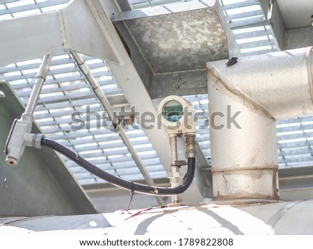 Temperature sensor for measuring instrument close up in industry zone at power plant.