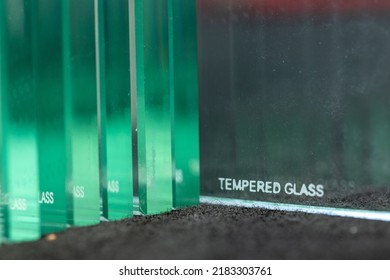 Tempered glass, inscription burned on thick glass to protect the material from breaking, Construction industry - Shutterstock ID 2183303761