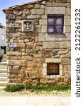 Templars Cross Pattee on a granite house, Idanha-a-Velha village, Serra da Estrela, Beira Alta, Portugal