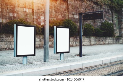 Template Of Two Empty City Billboards On Train Station Outdoors Or Metro Station; Mock-up Of Blank Informational Banners In Urban Settings Near Tram Stop With Electronic Indicator Panel Behind