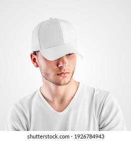 Template of a white baseball cap on a guy's head, headdress for protection from the sun, isolated on background. Sports hat mockup with visor, universal panama hat, for design presentation, front view