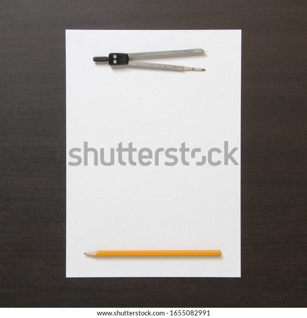 Template of white paper, divider and pencil on dark\
wenge color wooden background. Concept of business plan and\
strategy, development of content. Stock photo with empty space for\
text and design. 