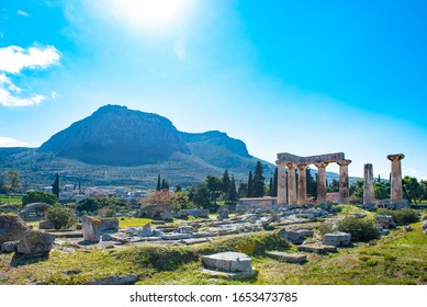 Temple of Apollo with Acrocorinth in the background. Ancient Corinth, Greece.