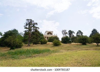 Temple of Apollo in the Lednice-Valtice cultural landscape on a hill above the pond Mlynsky, UNESCO heritage site in summer sunny day, Moravia, Czech Republic
