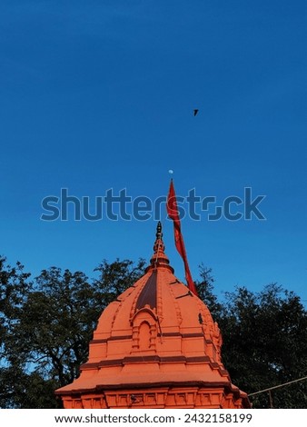 temple with background of blue sky and moon on top of it