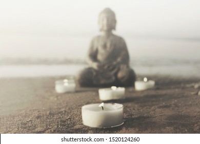 temple with buddha statue and lit candles that illuminate the spirit - Powered by Shutterstock